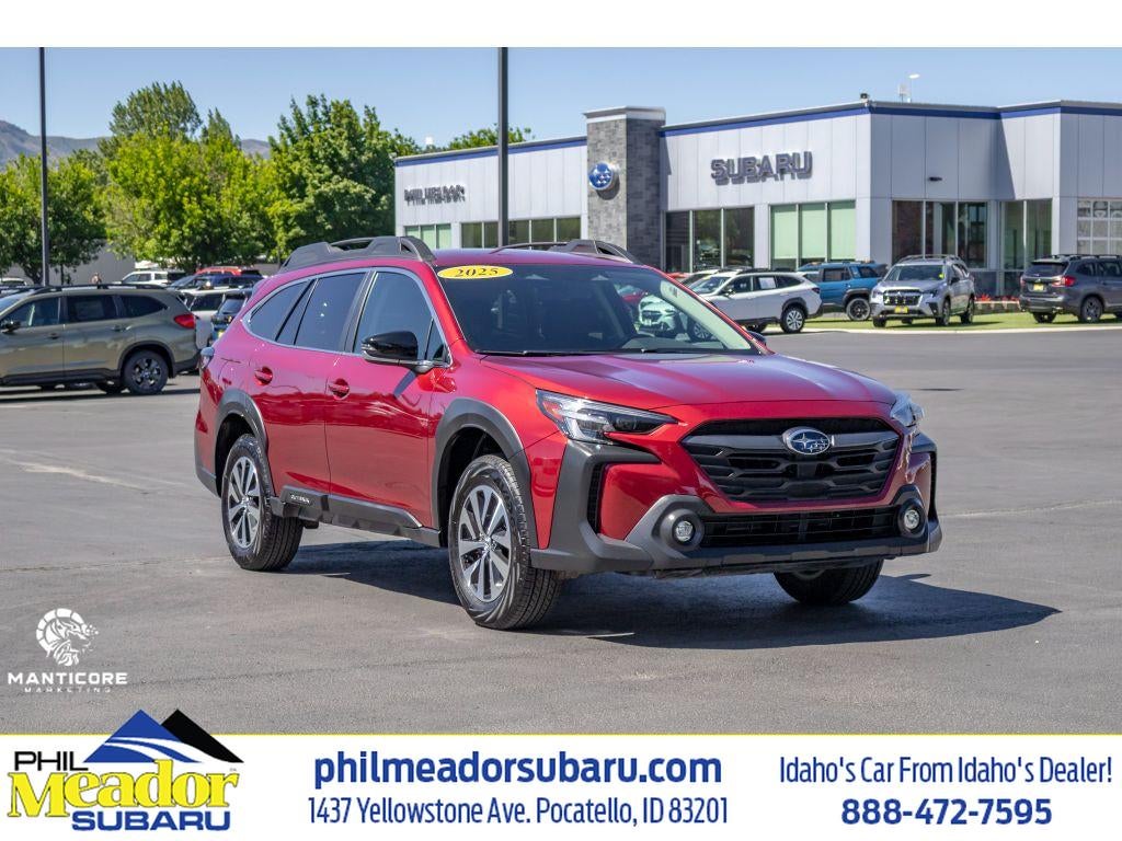 2025 Subaru Outback Premium in Crimson Red Pearl — front three-quarter view