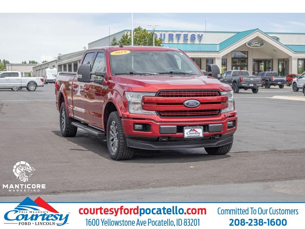 2019 Ford F-150 Lariat in Red — front three-quarter view