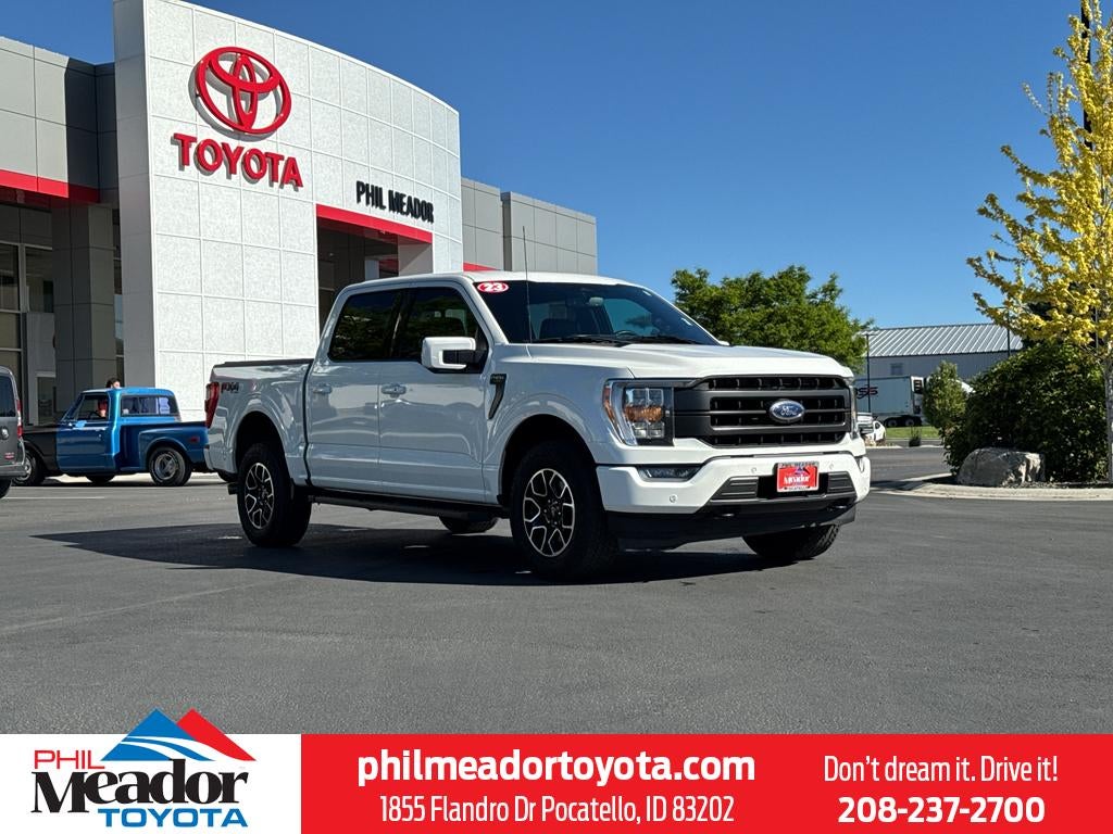 2023 Ford F-150 LARIAT in Star White Metallic Tri-Coat — front three-quarter view